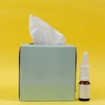 white and brown bottle beside white tissue box